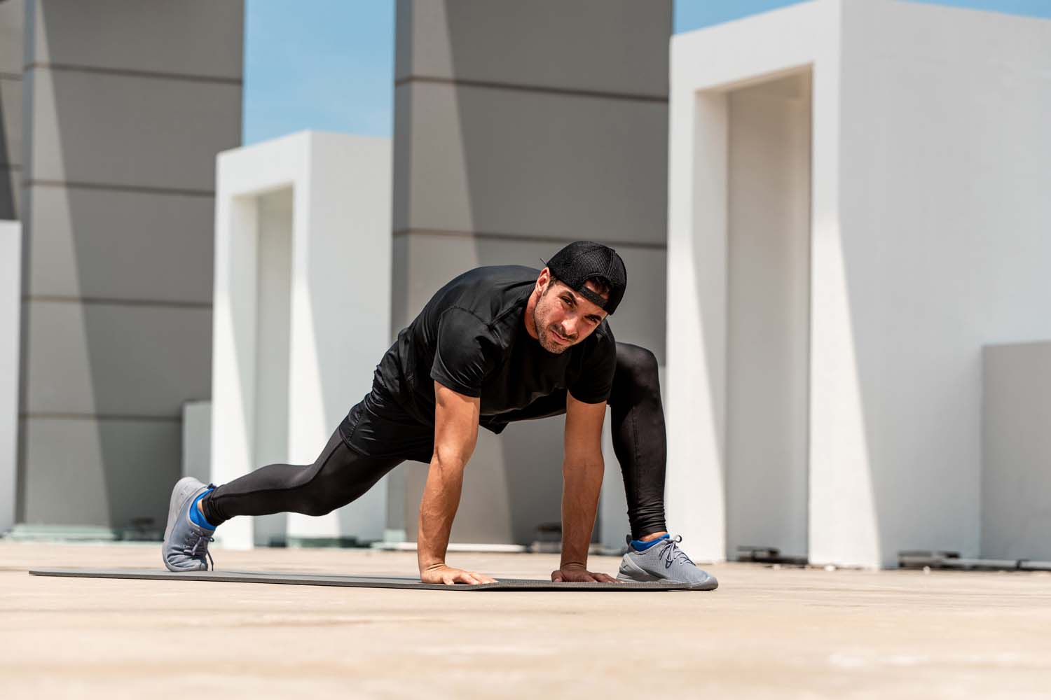 man exercising on a roof top