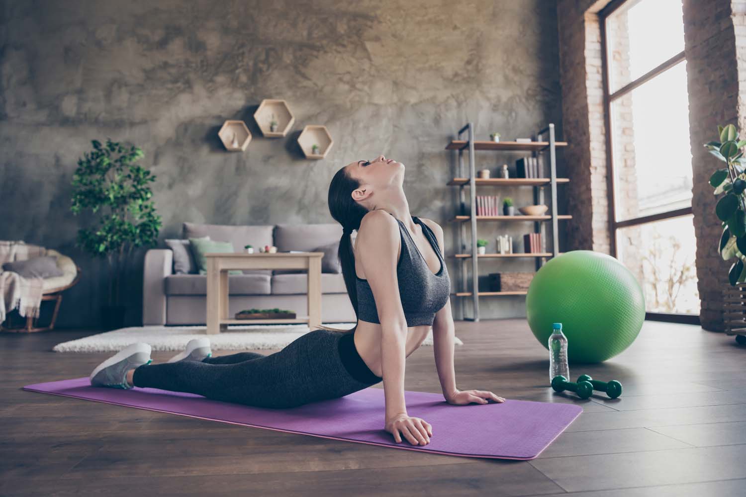 women stretching spine